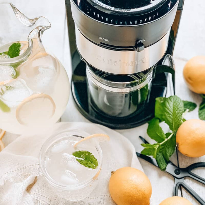 Presse-agrumes avec carafe en verre